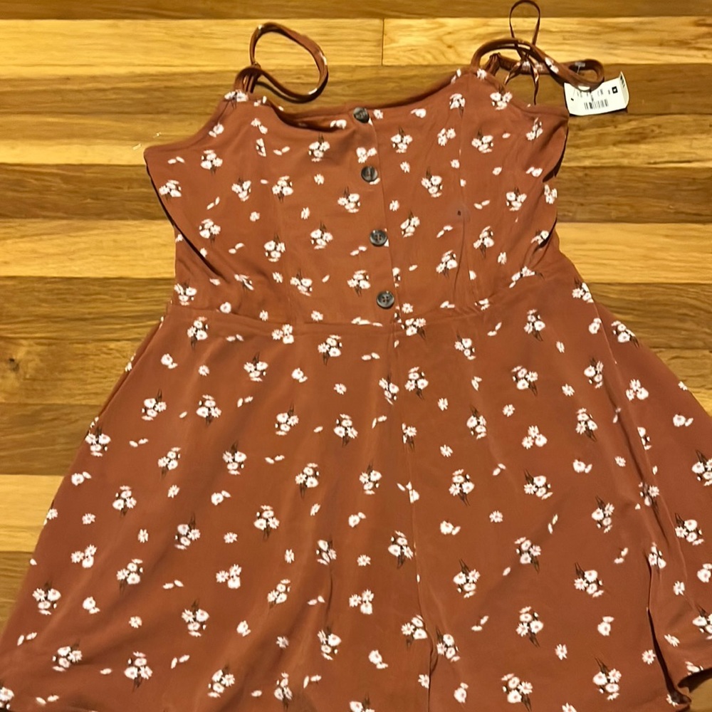 Never worn and looks like a dress on even though it’s a romper